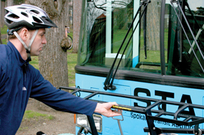 Step Two. Squeeze the bike rack handle to release the rack for lowering.