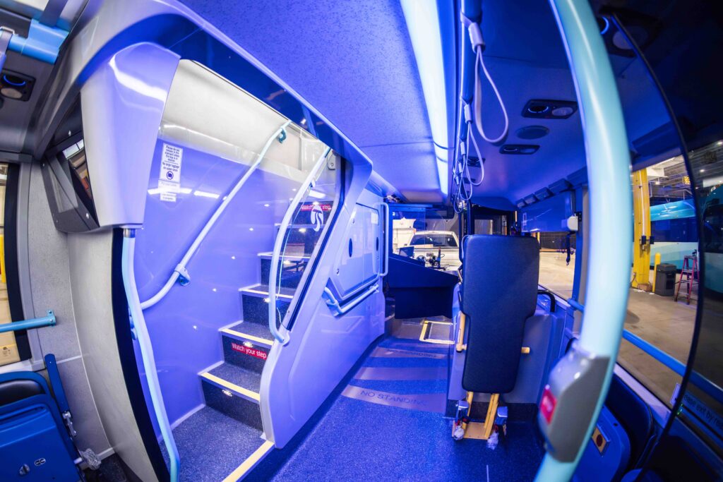 STA double decker bus interior, showing stairs to upper deck and STA fixed-route operator’s seat.