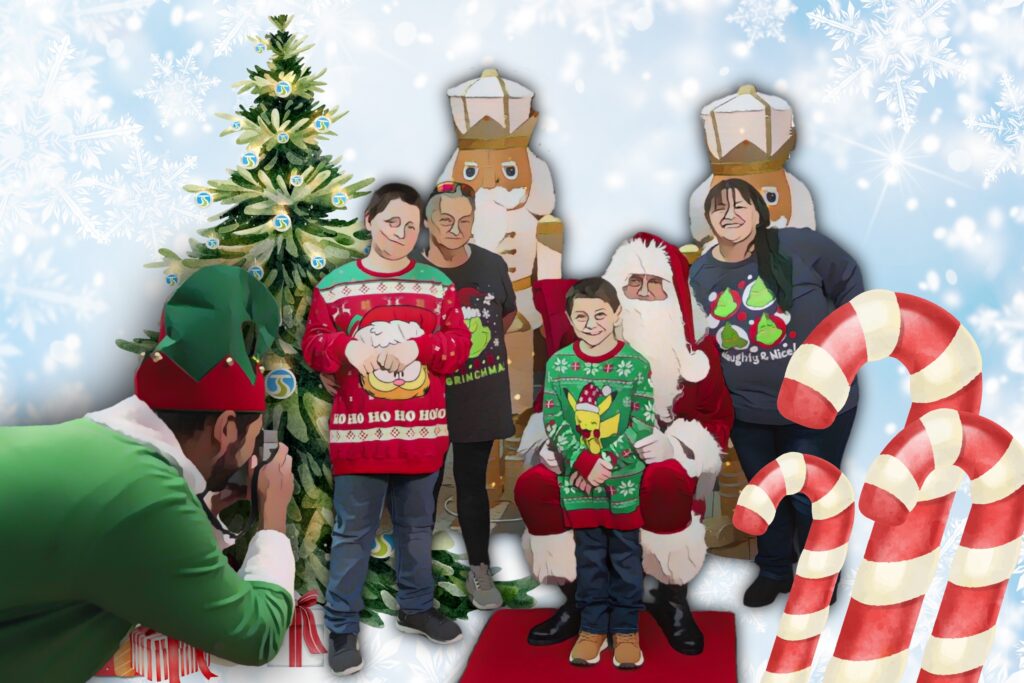 Family in Christmas sweaters poses with Santa inside STA Plaza by a tree as an elf takes their photo.