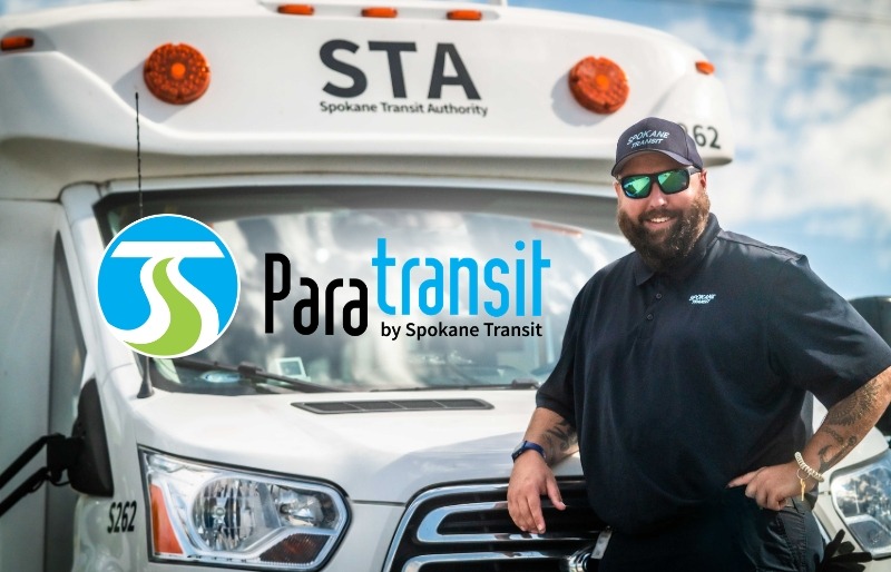 Driver stands by a Spokane Transit Authority paratransit van displaying the STA logo.