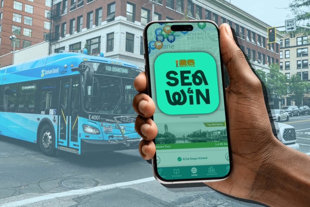 SEA&WIN mobile app display with STA Blue Wave bus in the background.
