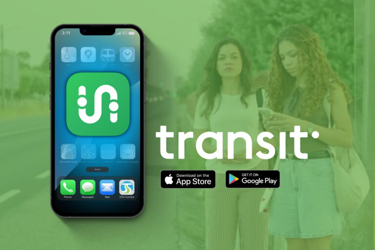 A large mobile display of Transit App with riders waiting at a bus stop in the background.